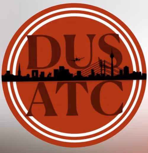Circular red logo with white rings featuring a black city skyline silhouette and an airplane flying among the letters DUS ATC.